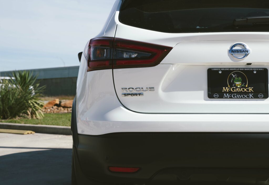 A Glacier White 2023 Nissan Rogue at the McGavock Dealership in Lubbock