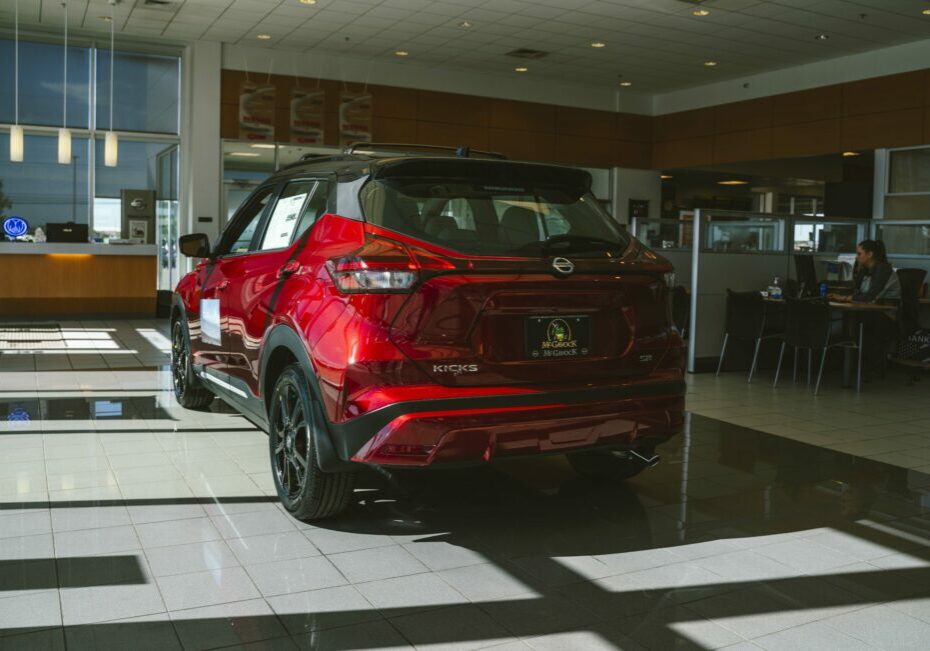 A Scarlet Ember Tintcoat 2023 Nissan Kicks at the McGavock Nissan Dealership in Lubbock.